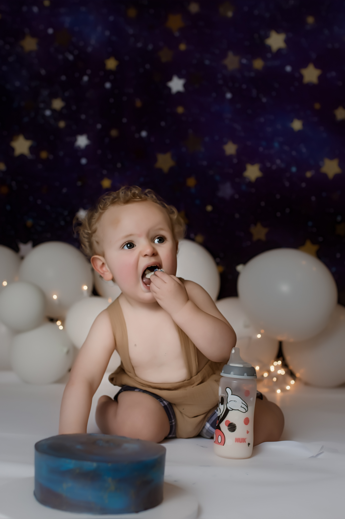 Cake Smash Photography - 18 month photo shoot with stars in the background.