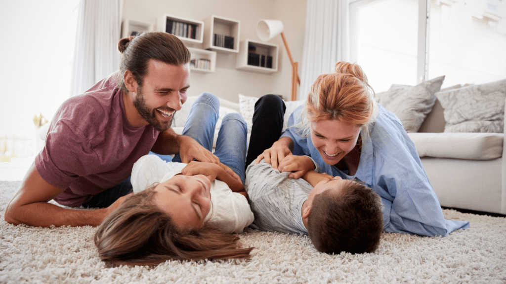 Embracing Beautiful Moments: A family plays together on the floor.