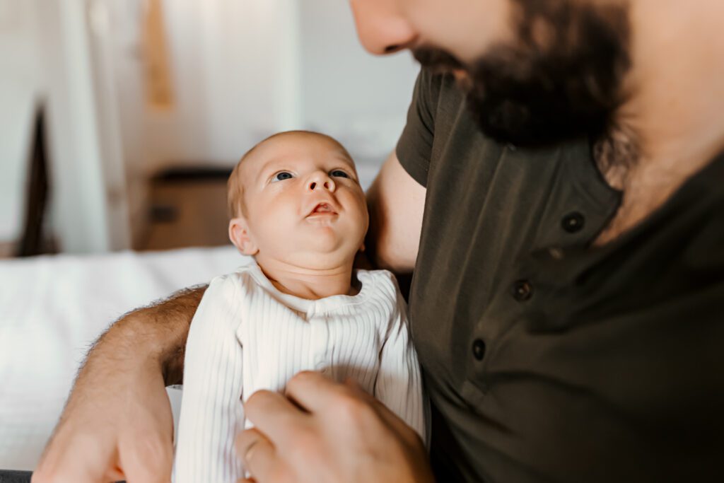 In-home newborn photography: A beautiful portrayal of the pure and tender connection between a baby and their parent